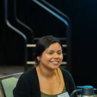 Student smiling at a table at Scholarship Dinner 2019